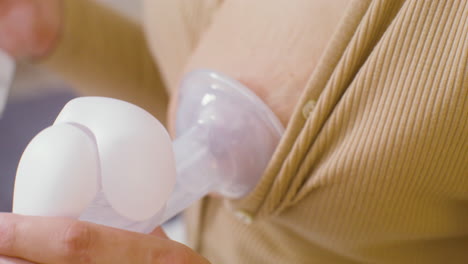Close-Up-Of-Female-Hands-Using-Breast-Pump