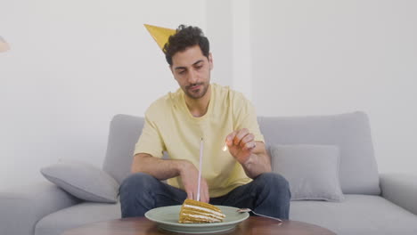 A-Dark-Haired-Man-Celebrates-His-Birthday-Alone