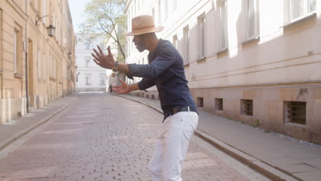 Afro-Caribbean-Man-Has-Fun-Dancing-Salsa-In-The-Street