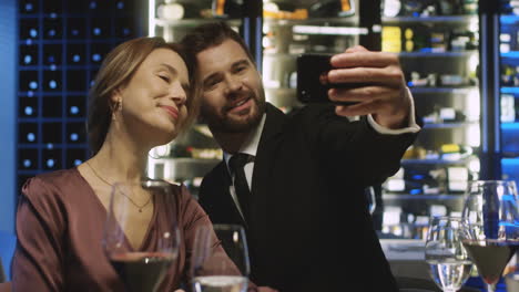 Couple-Taking-A-Selfie-And-Smiling