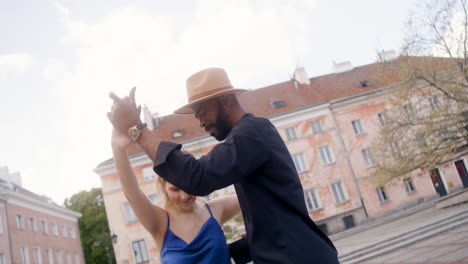 Interracial-Couple-Dancing-Salsa-In-A-Public-Square