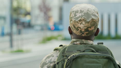 An-Soldier-In-Uniform-Walks-Outdoors