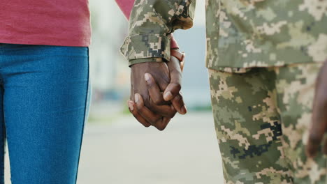 Soldier-And-His-Girlfriend-Hands-Holding-Hands