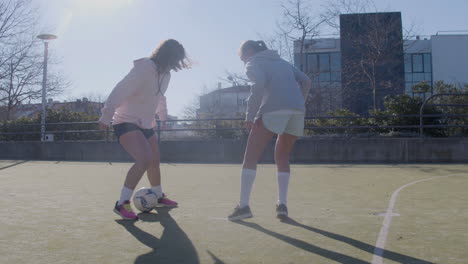 Four-Female-Friends-Playing-Soccer-Outdoors