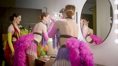 Three-Showgirls-Applying-Makeup-In-The-Backstage-3