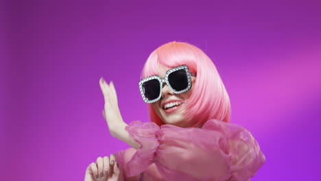 Portrait-Of-Beautiful-Woman-Wearing-A-Pink-Wig-And-Fancy-Glasses
