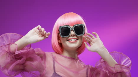 Portrait-Of-Beautiful-Woman-Wearing-A-Pink-Wig-And-Fancy-Glasses-1