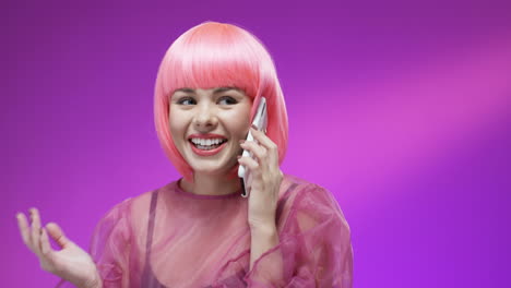 Close-Up-Of-Cheerful-Woman-Wearing-A-Pink-Wig