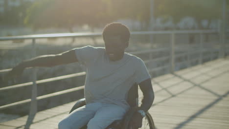 Young-Black-Man-In-Wheelchair-Singing-And-Dancing-In-City-Park
