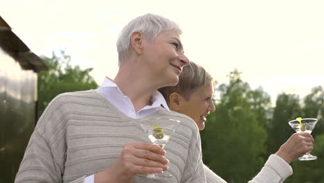 Two-Women-Talking-And-Having-A-Drink-Outdoors