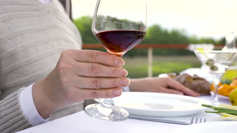 Close-Up-Of-A-Woman's-Hand-Holding-A-Glass-Of-Wine