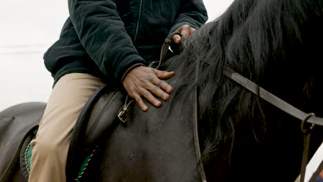 Close-Up-Of-Man-Petting-A-Black-Horse