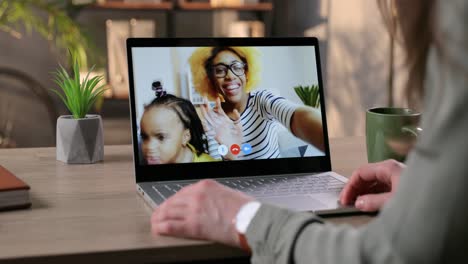 Woman-Video-Calling-On-Laptop-And-Talking-With-Happy-Female-Friend-And-Her-Daughter-Indoor