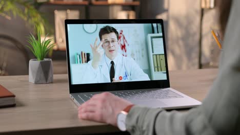 Woman-Having-Medical-Online-Consultation-With-Doctor-Through-Video-Conference-At-Home-And-Sipping-Drink-From-Cup