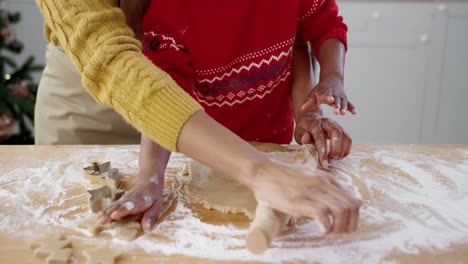 Close-Up-Of-Female-Hands-With-Little-Cute-Child-At-Table-In-Home-Kitchen-Making-Dough-For-Cookies