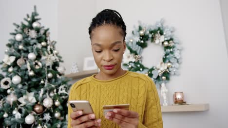 Close-Up-Portrait-Of-Happy-Woman-Making-Xmas-Sale-Purchase-Online-On-Smartphone-With-Happy-Face