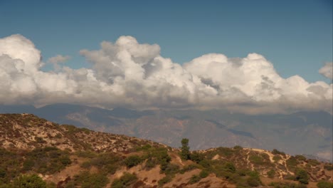 Time-Lapse-Clouds-Roil-Over-A-Mountain-Range