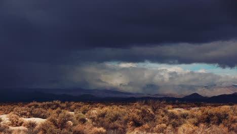 Time-Lapse-Storm-Clouds-Travel-Over-Desert-And-Mountains