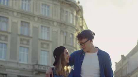 Portrait-Shot-Of-Young-Couple-Of-Hipsters-Standing-Outdoors