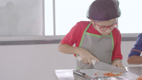 Chef-kid-cooking,-cutting-and-baking,-minichef-9