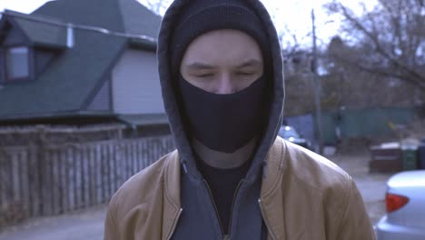 Man-In-The-Street-Wearing-Facemask-Looking-At-The-Camera