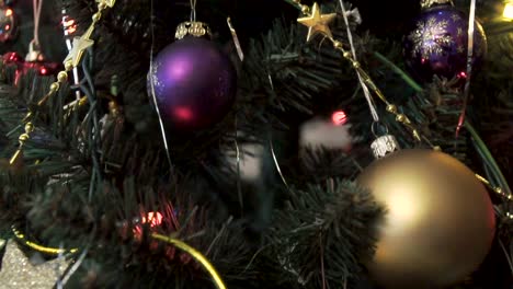 Pedestal-downward-rotating-shot-of-decorated-Christmas-tree