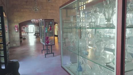A-view-of-a-showcases-of-the-Gordiola-Glassworks-and-Museum-Mallorca,-a-large-and-fascinating-collection-of-pieces-tracing-the-manufacturing-history-of-the-glass-works