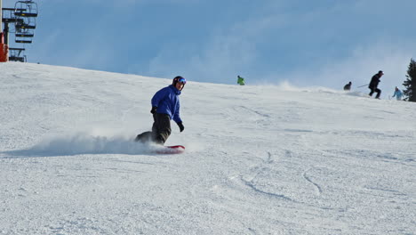 Teenage-boy-snowboarding-on-the-slope