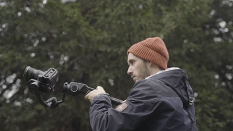 Cameraman-filming-with-gimbal,-close-up-shot