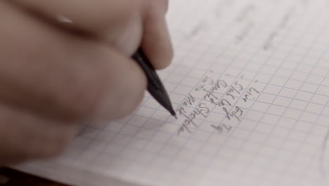 Notes-are-written-in-a-notebook-with-a-mechanical-pencil-slow-motion-close-up