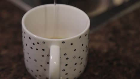 Slowly-Pouring-Hot-Water-In-A-Cup-With-Soup-Mix---Close-Up-Shot