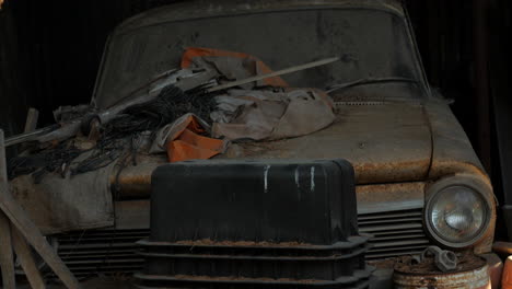 Rusty-old-classic-car-left-to-degrade-in-a-garage