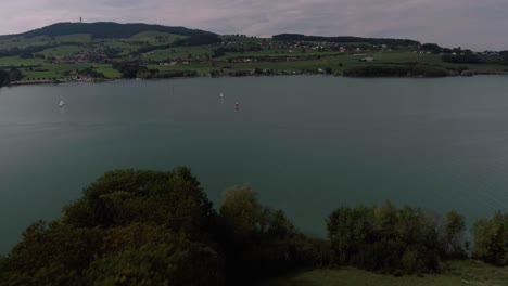 Aerial-Flight-Over-Nature-Showing-Sailboats-,-Lake-Gruyère