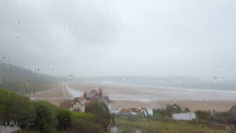 Raindrops-Falling-against-a-Window-with-an-Ocean-View-in-Real-Time