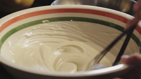 A-Hand-Mixing-A-Pancake-Batter-In-A-Large-Bowl---Close-Up-Shot