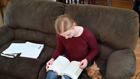 Madelyne's-study-scene-ending-with-a-huge-smile-after-she-pets-her-Yorkshire-terrier