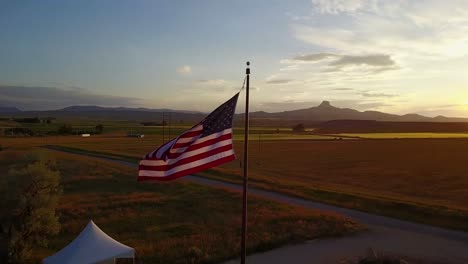 American-flag-waves-over-rural-landscape
