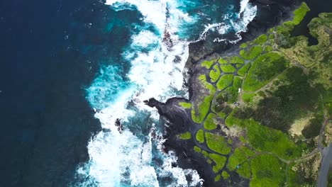 The-Big-Island-of-Hawai'i-housing-beautiful-contrasts-of-black,-green-and-blue,-all-shown-from-above-4