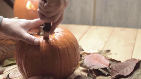 Carving-a-pumpkin-for-Halloween-Jack-o-Lanternfac