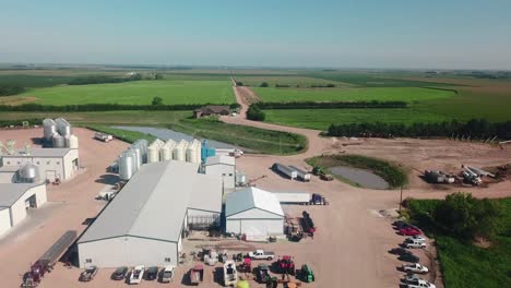 Aerial-view-of-the-storage-bins,-warehouses,-tractors-and-trailers-of-a-cover-seed-agribusiness-in-Nebraska-USA,-but-exports-seeds-around-the-world-2