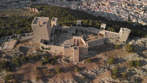 Castillo-de-Jaen,-Spain-Jaen's-Castle-Flying-and-ground-shoots-from-this-medieval-castle-on-afternoon-summer,-it-also-shows-Jaen-city-made-witha-Drone-and-a-action-cam-at-4k-24fps-using-ND-filters-4