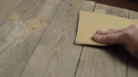 Hand-sanding-wood-with-sandpaper