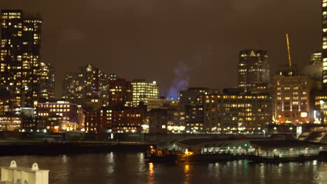 Port-of-Vancouver-cityscape-scene-at-night,-Pan-shot