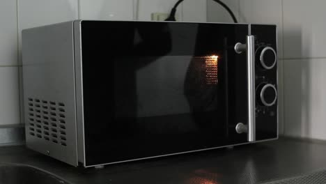 Turning-microwave-on,-letting-it-run-a-while-and-turning-it-off--wideshot