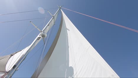 Looking-up-on-a-sail-on-a-sailing-boat-during-a-beautiful-sunny-day-at-sea