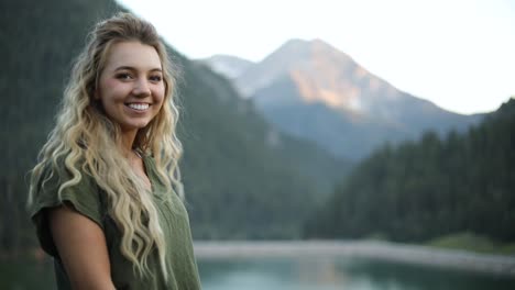 Slow-Motion-Shot-of-a-happy-beautiful-blonde-female-overlooking-a-gorgeous-scene-in-the-mountains-2
