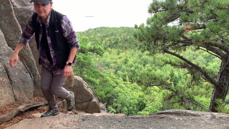 4K-shot-Lady-Climbs-Beehive-Mountain-in-Acadia-National-Park