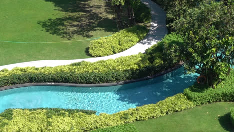 Beautiful-swimming-pool-in-garden-decoration-in-hotel-resort