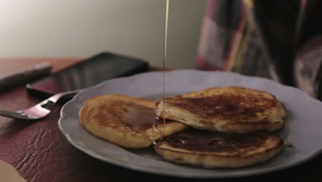 Filling-Pancakes-With-Maple-Syrup---Close-Up-Shot