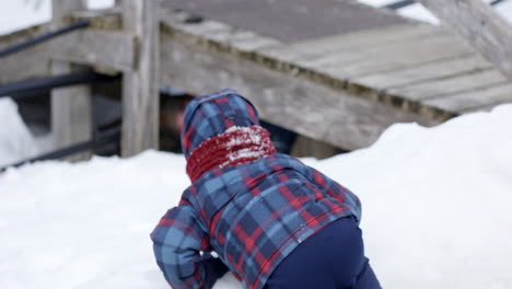 Toddler-boy-finds-father-under-bridge-in-winter-playing-hide-ans-seek